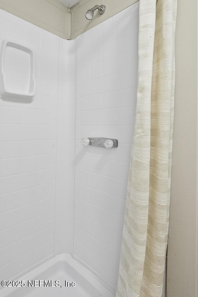 28 Neighbors Cove Road Orange Park, FL 32065 - Photo 42 of 56 a bathroom with a shower