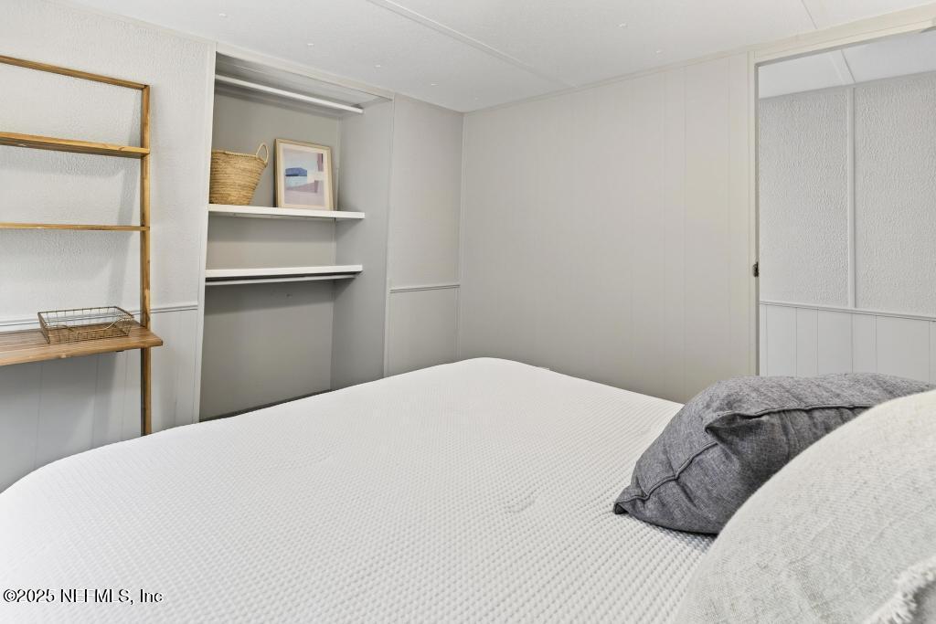 28 Neighbors Cove Road Orange Park, FL 32065 - Photo 45 of 56 a bedroom with a bed and a window