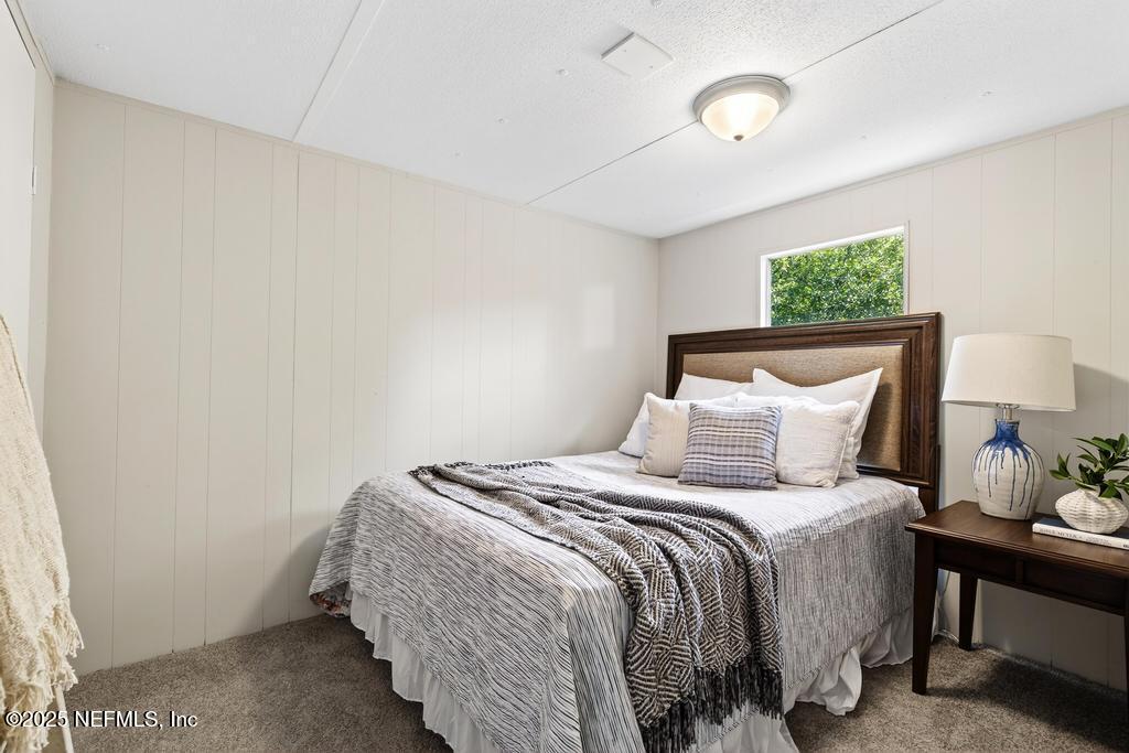 28 Neighbors Cove Road Orange Park, FL 32065 - Photo 48 of 56 a bedroom with a bed and a window