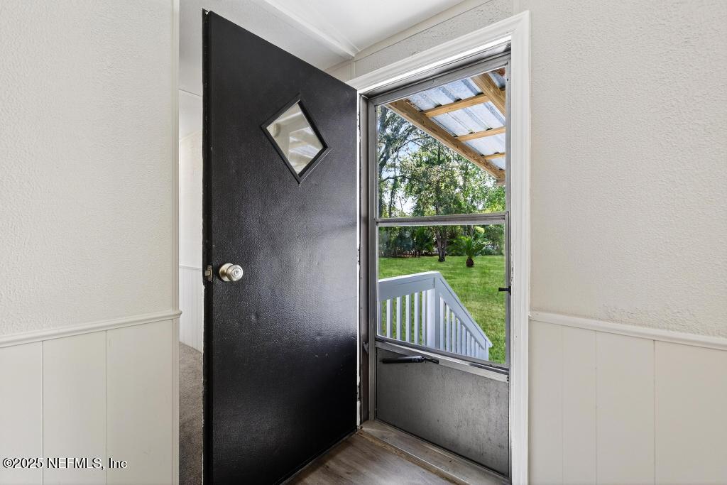 28 Neighbors Cove Road Orange Park, FL 32065 - Photo 10 of 56 a view of a hallway with wooden floor and a window