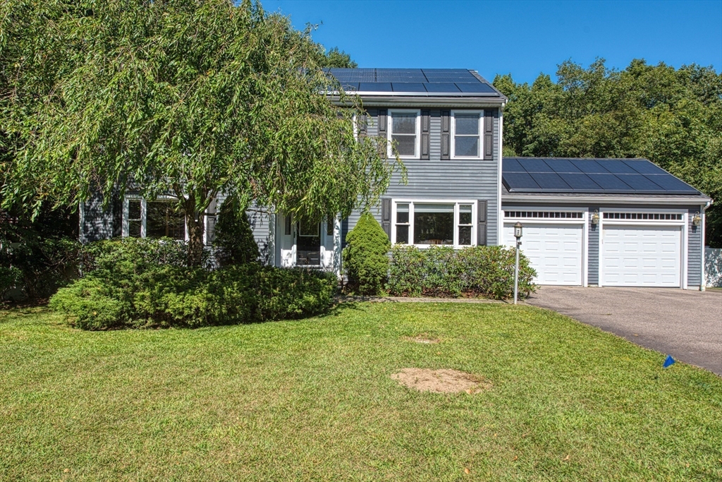 60 Aspen Road Sharon, MA 02067 - Photo 2 of 42 a front view of a house with a yard