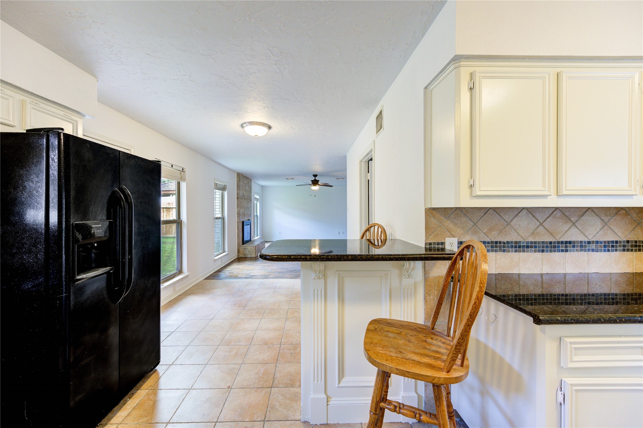 3639 Fir Forest Drive Spring, TX 77388 - Photo 19 of 44 a kitchen with granite countertop a refrigerator and a stove top oven