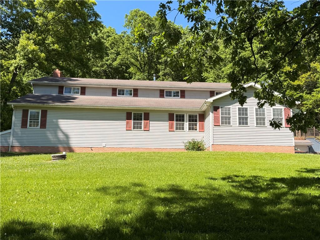526 East River Road Edinburg, PA 16116 - Photo 2 of 45 a front view of a house with a yard