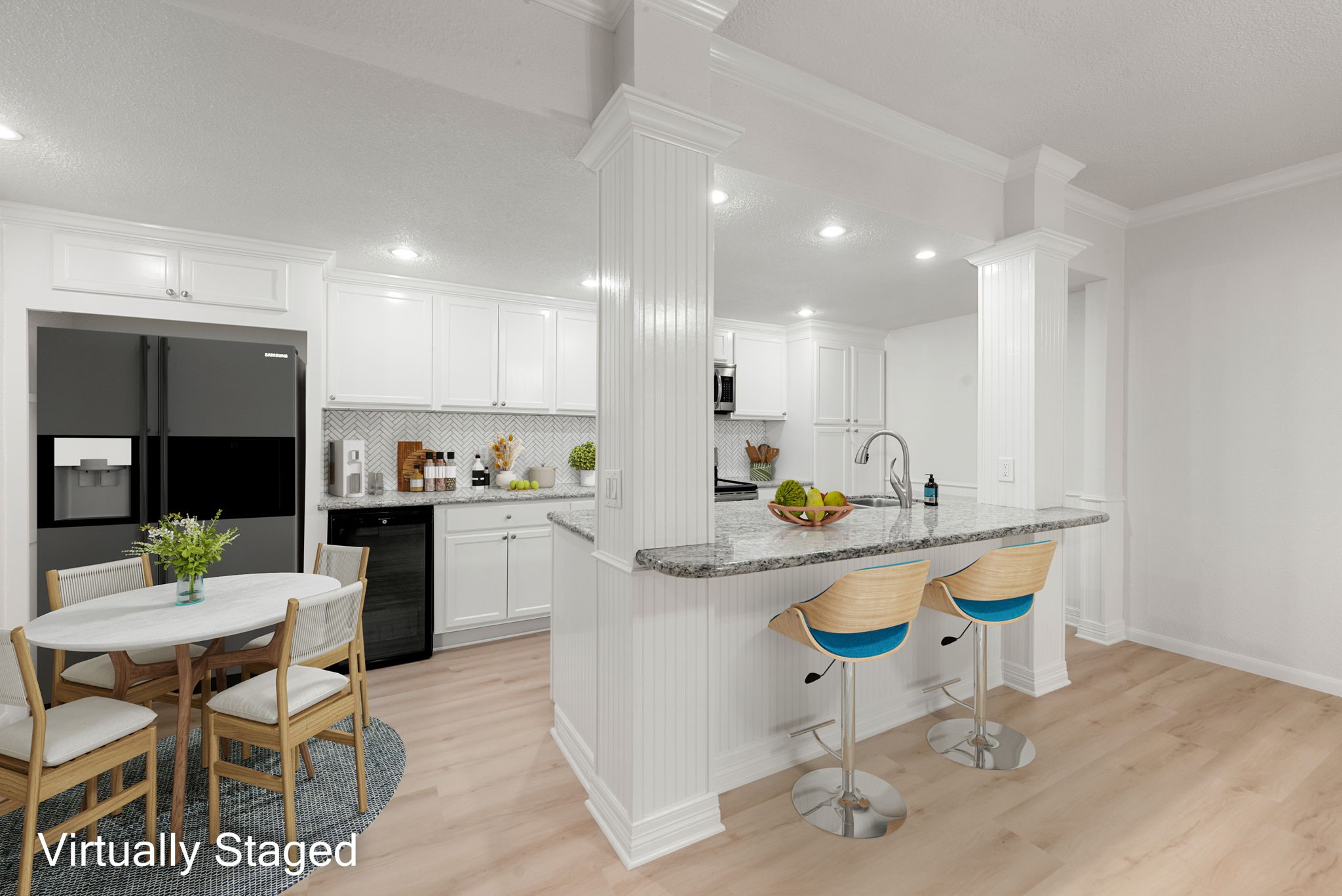 a kitchen with a dining table chairs sink and stove