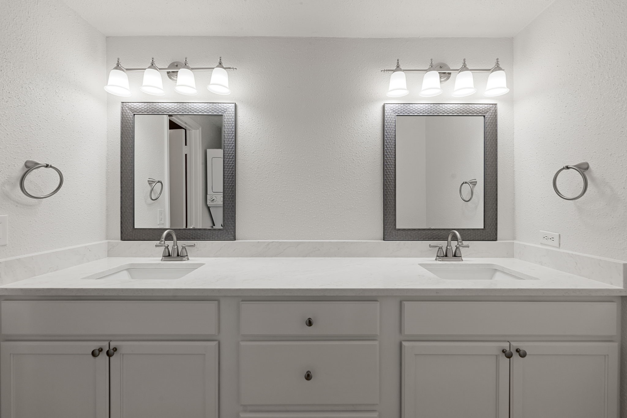 5711 Sugar Hill Drive, Unit 69 Houston, TX 77057 - Photo 12 of 16 a bathroom with double vanity sinks and a mirror