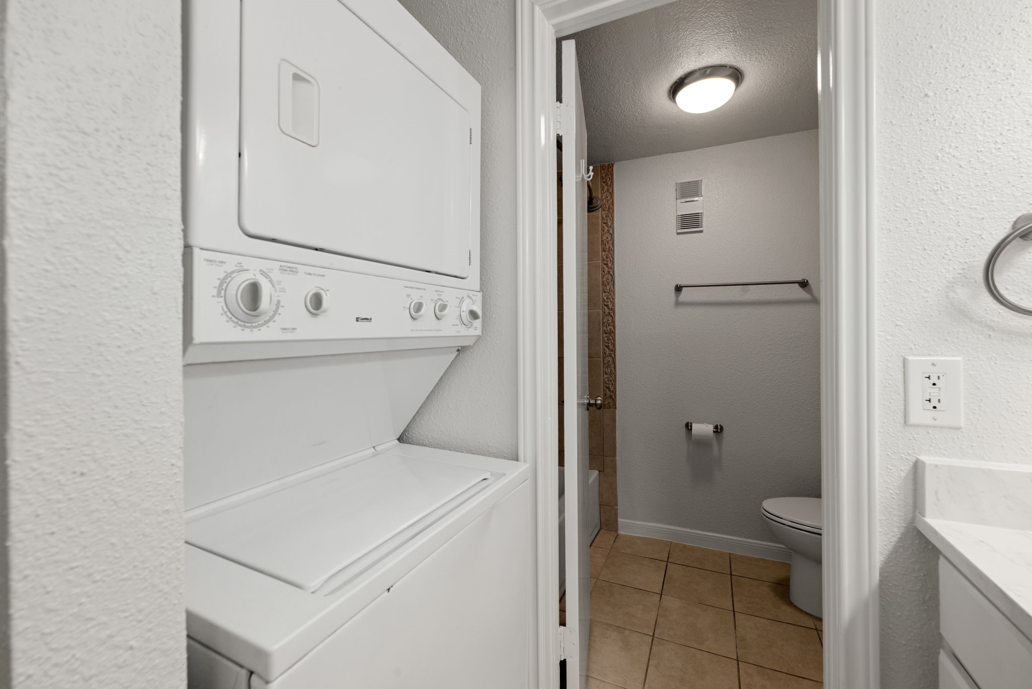 5711 Sugar Hill Drive, Unit 69 Houston, TX 77057 - Photo 13 of 16 a bathroom with a sink a toilet and a mirror