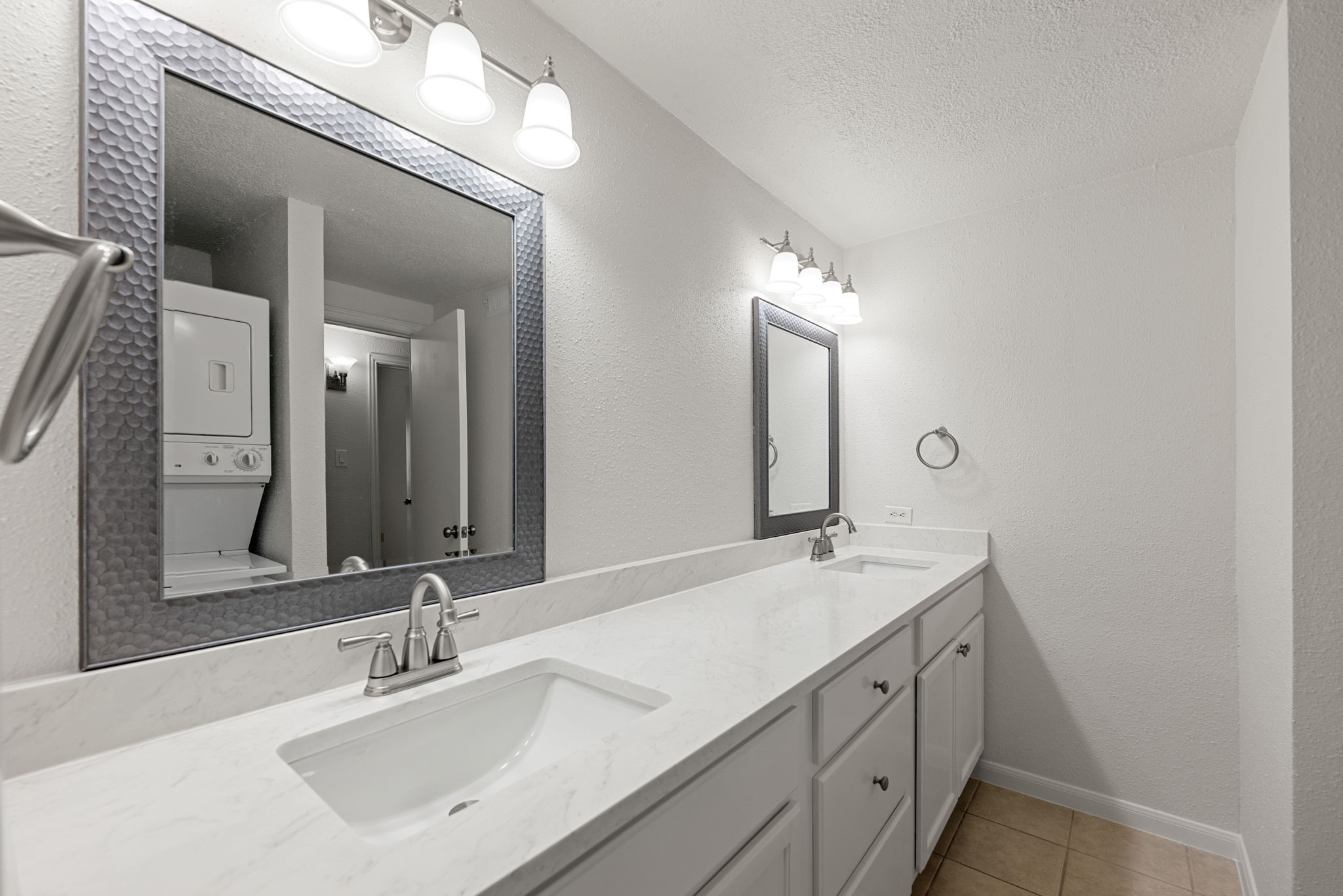 5711 Sugar Hill Drive, Unit 69 Houston, TX 77057 - Photo 14 of 16 a bathroom with a double vanity sink and a mirror