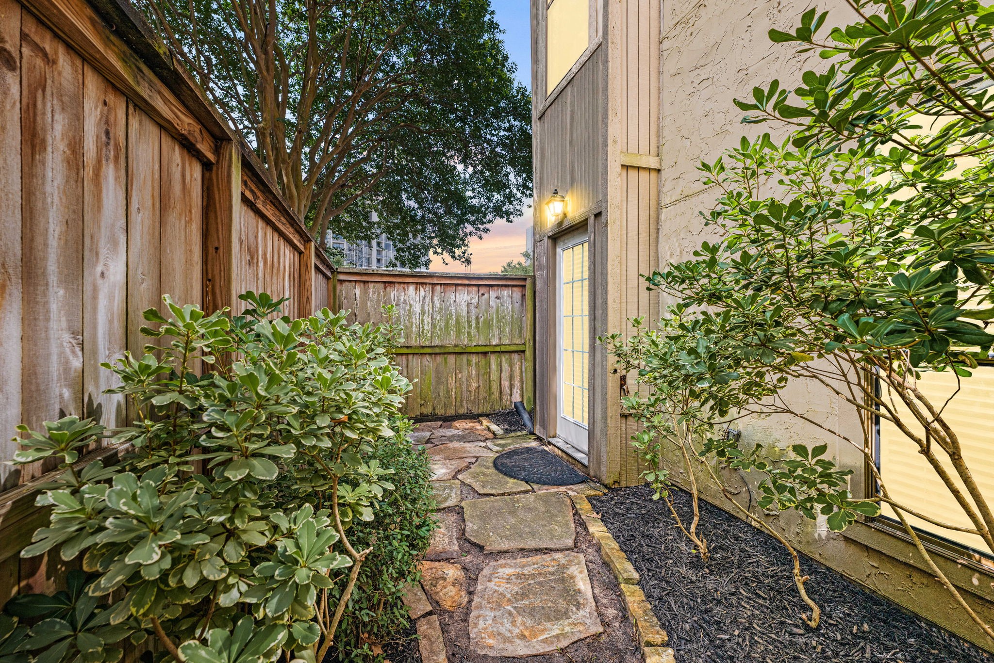 5711 Sugar Hill Drive, Unit 69 Houston, TX 77057 - Photo 2 of 16 a view of a backyard with garden