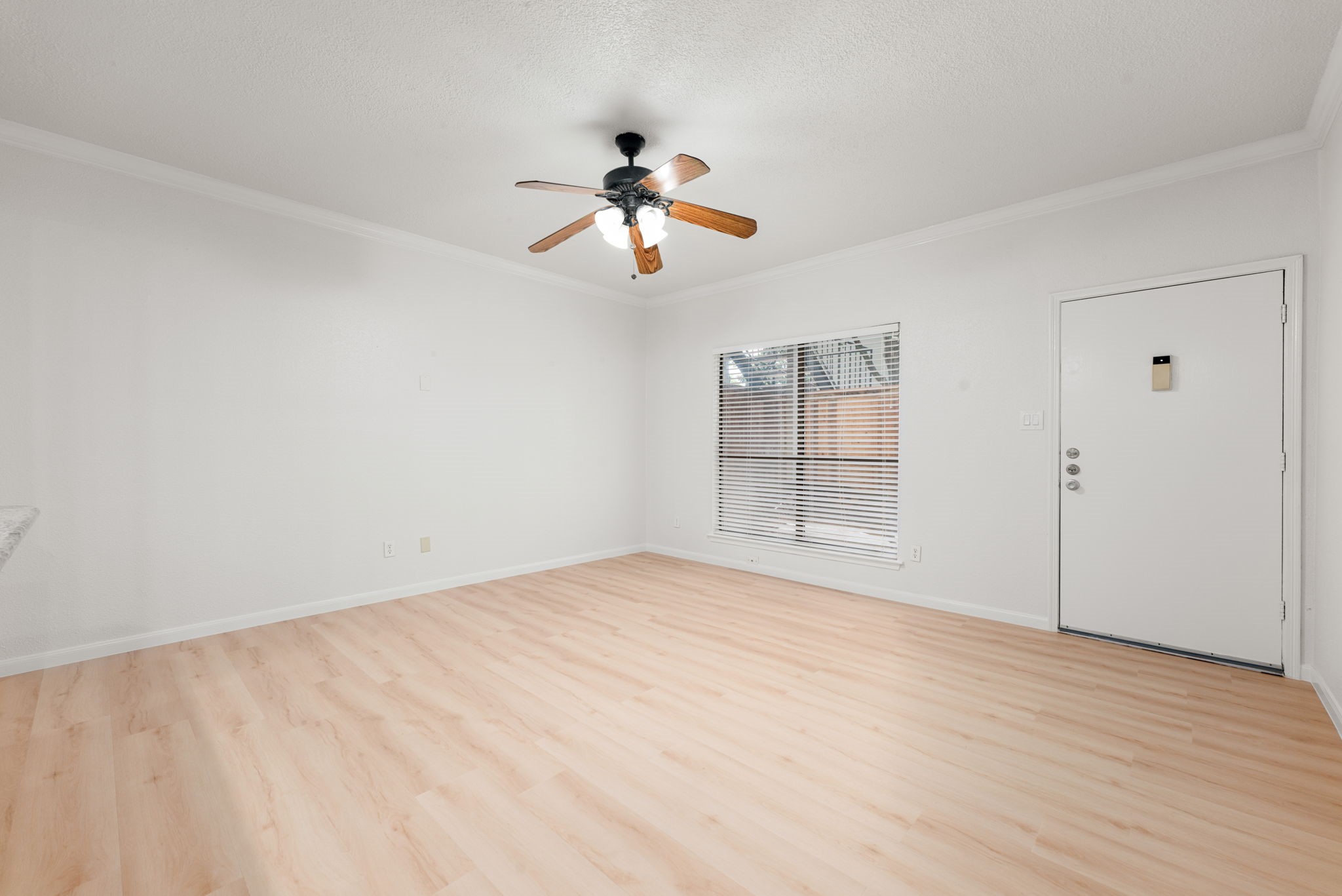 5711 Sugar Hill Drive, Unit 69 Houston, TX 77057 - Photo 4 of 16 a view of empty room with wooden floor and fan