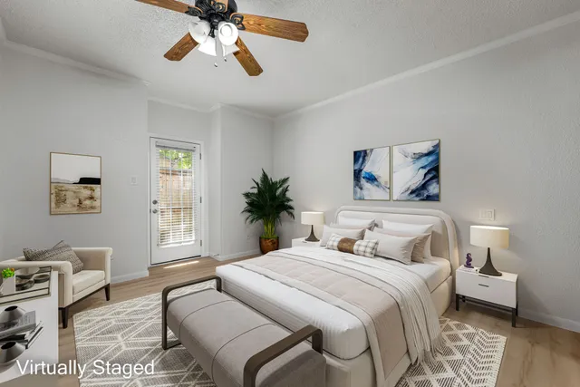 a bedroom with a large bed and a window