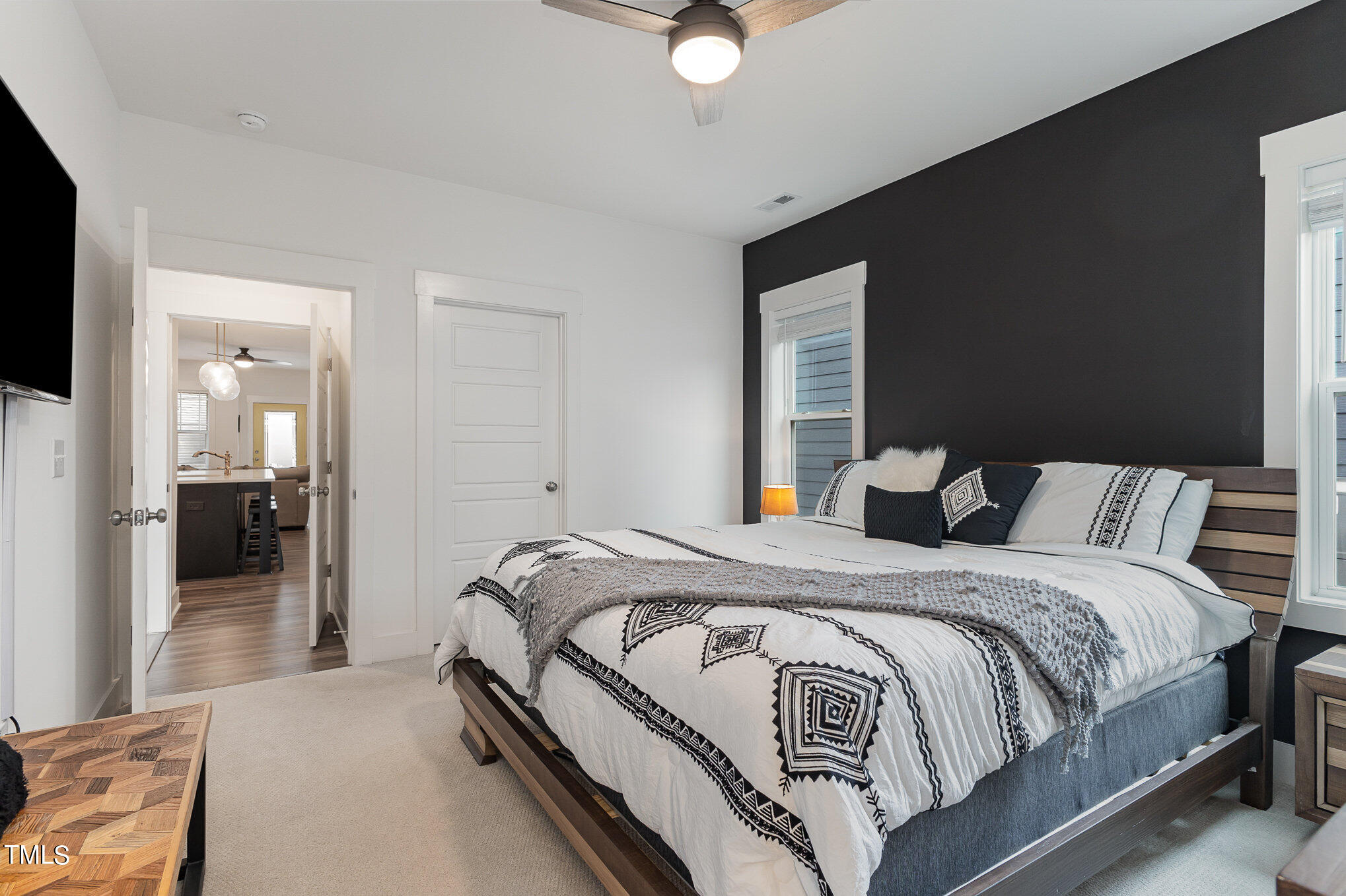 205 Daniel Ridge Road Wendell, NC 27591 - Photo 14 of 24 a spacious bedroom with a bed and a flat screen tv