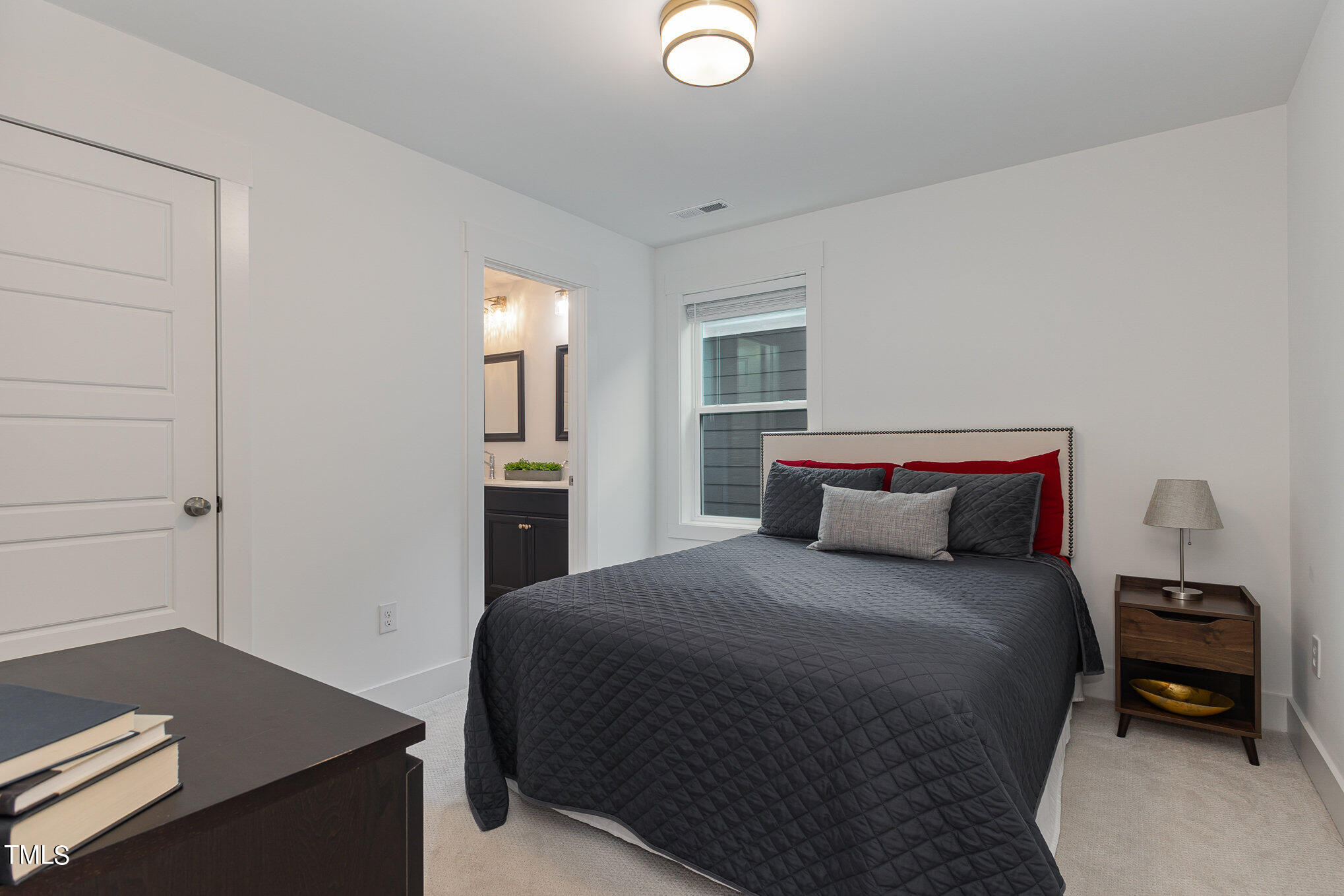 205 Daniel Ridge Road Wendell, NC 27591 - Photo 19 of 24 a bedroom with a bed and a desk