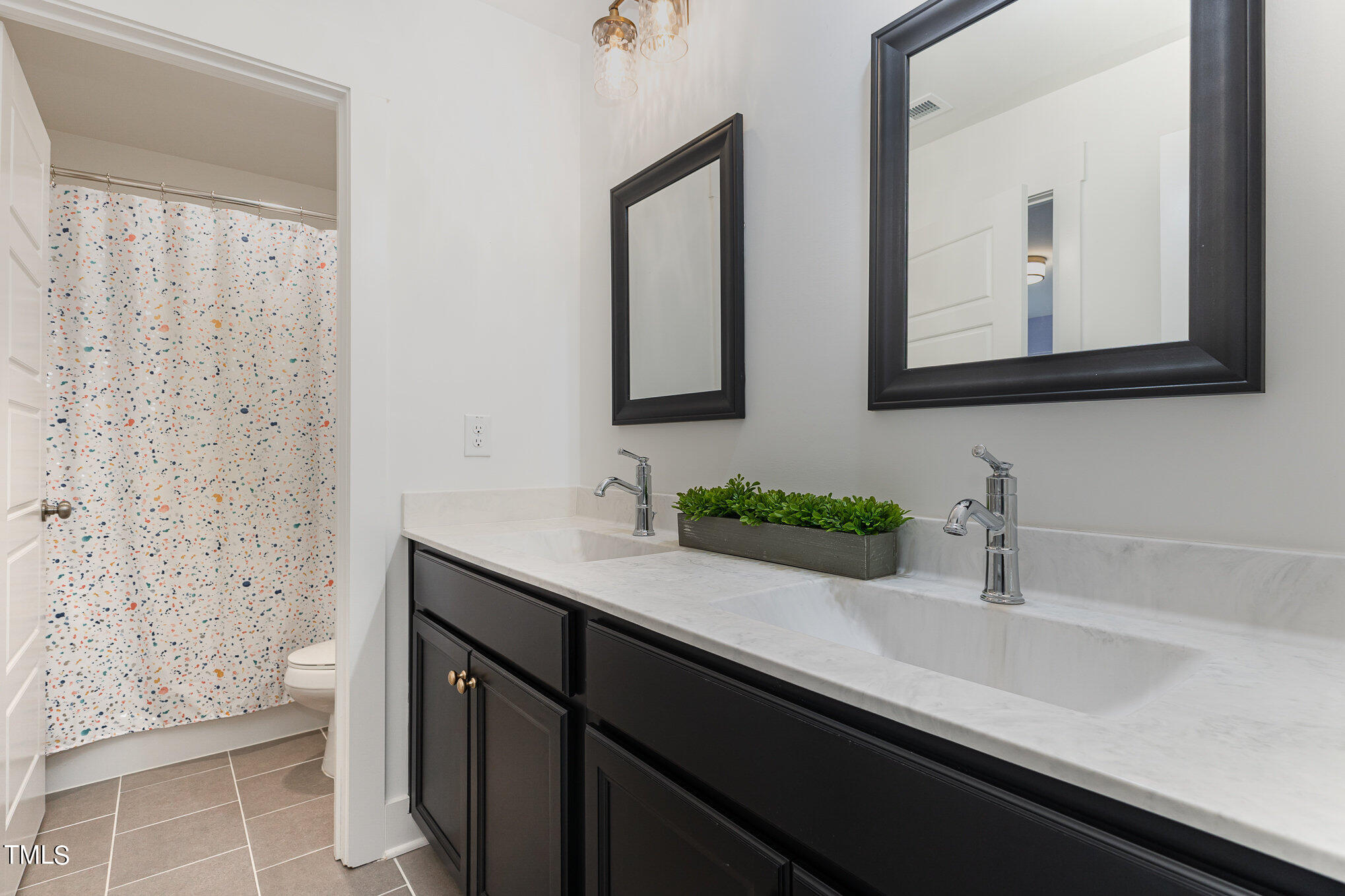 205 Daniel Ridge Road Wendell, NC 27591 - Photo 20 of 24 a bathroom with a sink and a mirror