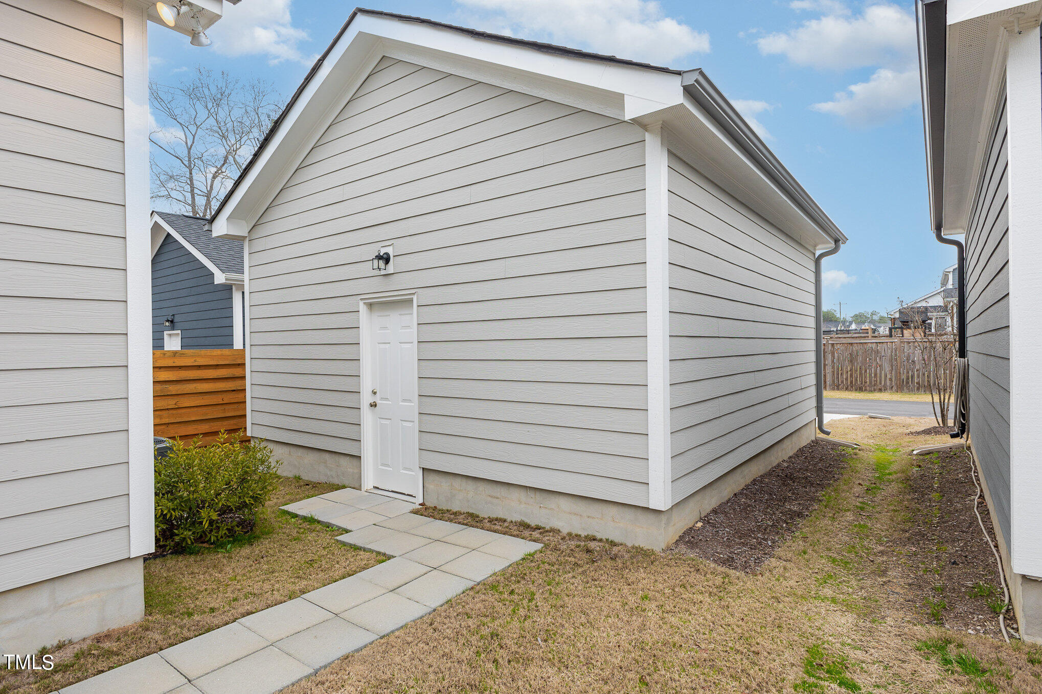 205 Daniel Ridge Road Wendell, NC 27591 - Photo 23 of 24 a view of a white house with white door