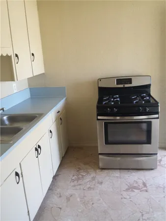 a kitchen with a stove and a microwave