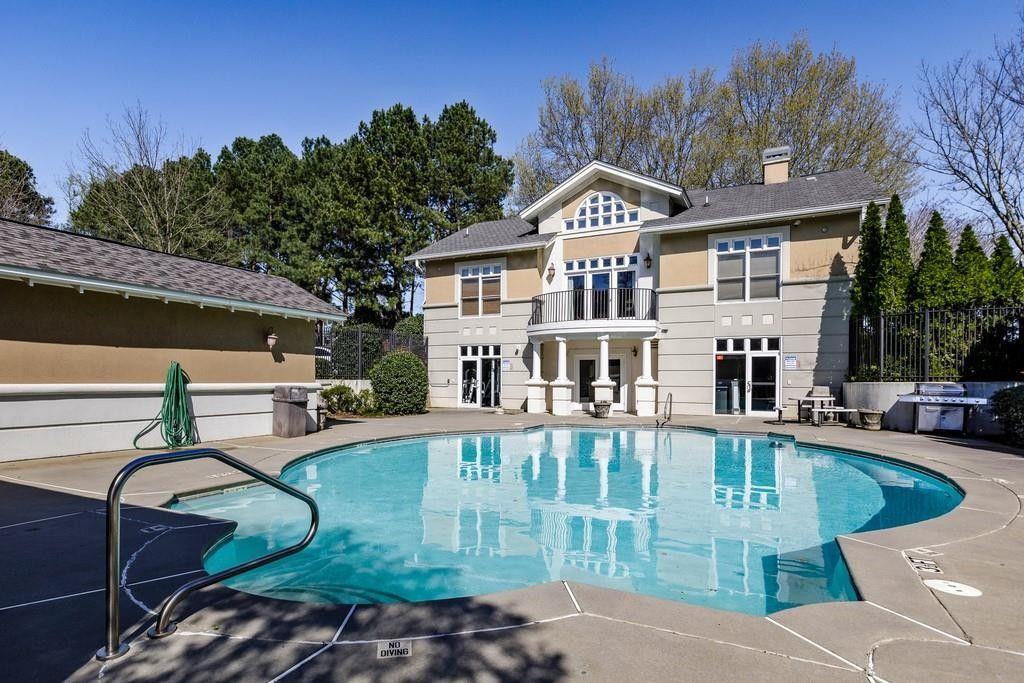 2700 Pine Tree Road Northeast, Unit 1115 Atlanta, GA 30324 - Photo 1 of 29 a front view of a house with garden