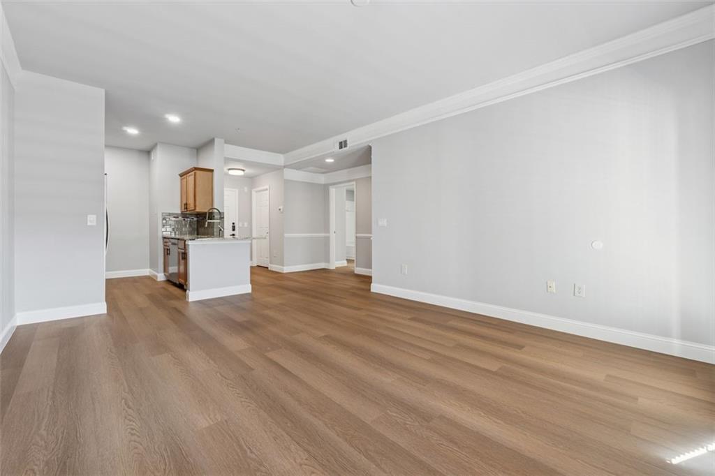 2700 Pine Tree Road Northeast, Unit 1115 Atlanta, GA 30324 - Photo 15 of 29 a view of kitchen view refrigerator and wooden floor