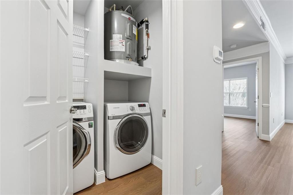2700 Pine Tree Road Northeast, Unit 1115 Atlanta, GA 30324 - Photo 23 of 29 a view of a hallway with washer and dryer