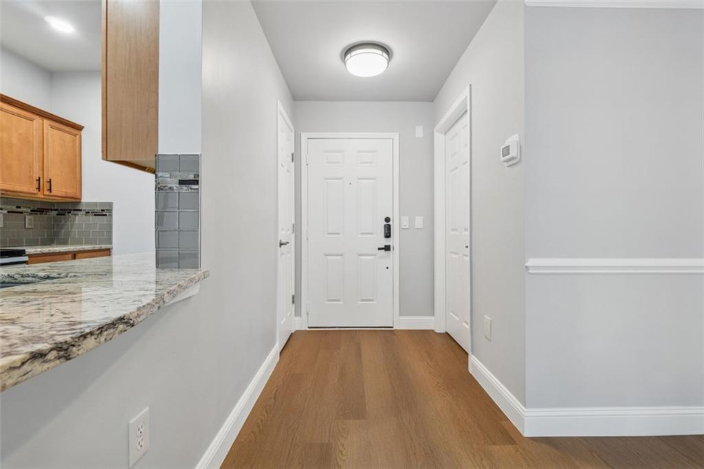 2700 Pine Tree Road Northeast, Unit 1115 Atlanta, GA 30324 - Photo 8 of 29 a view of a kitchen from the hallway