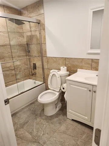 a bedroom with a bed and a chair