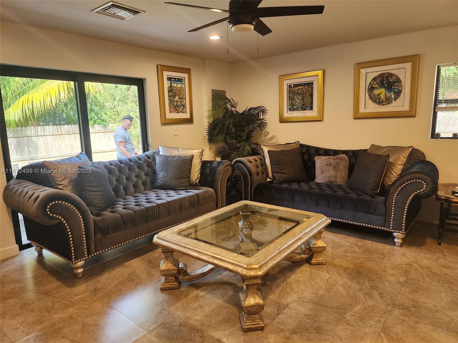 413 Southwest 10th Street Delray Beach, FL 33444 - Photo 4 of 16 a living room with furniture and a large window
