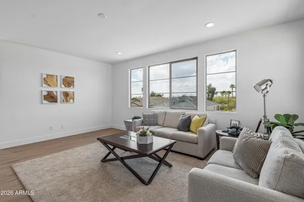 a living room with furniture and a window