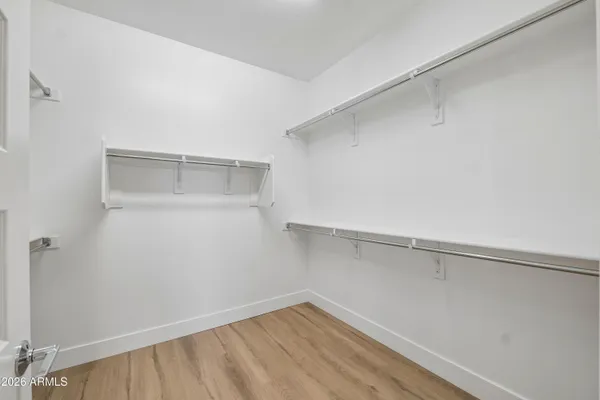 a view of an empty walk in closet