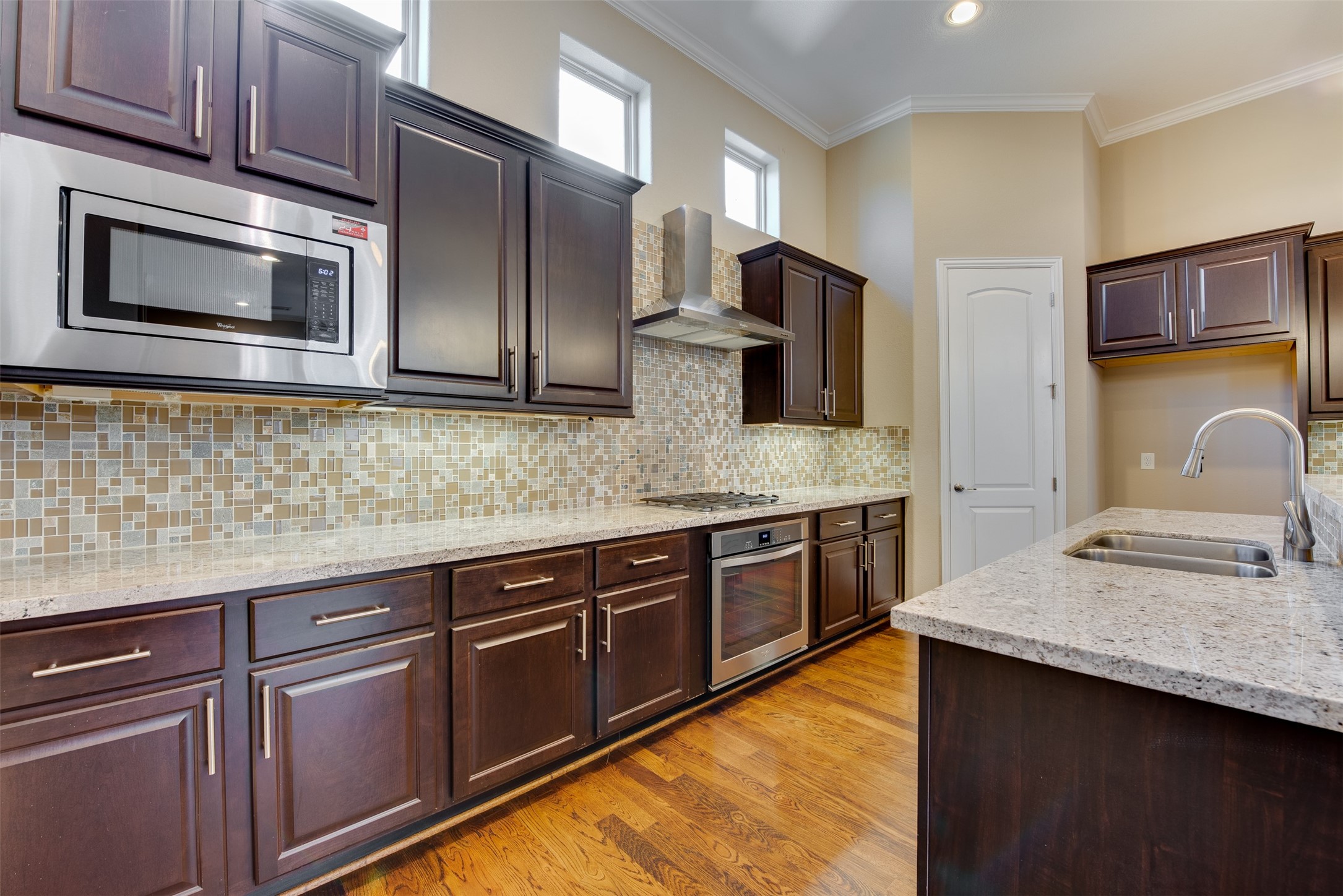 6105 Stillman Street Houston, TX 77007 - Photo 13 of 33 a kitchen with stainless steel appliances granite countertop a sink stove and microwave