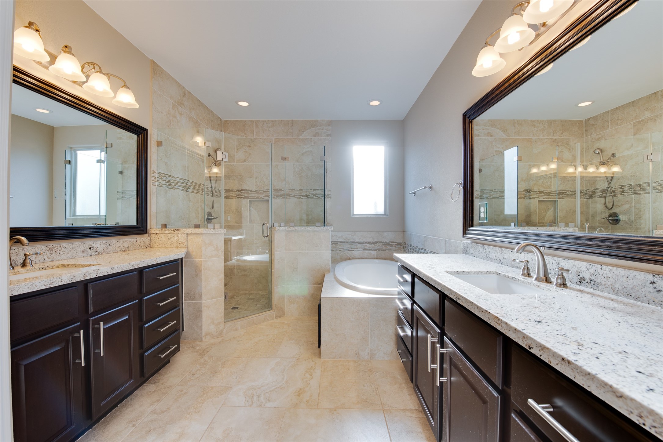 6105 Stillman Street Houston, TX 77007 - Photo 22 of 33 a bathroom with a granite countertop sink a toilet a mirror and vanity