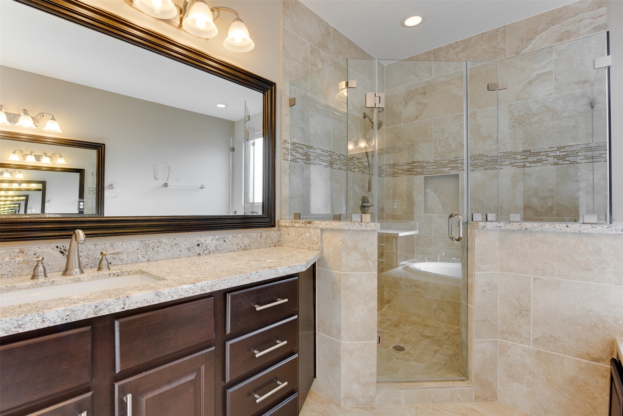 6105 Stillman Street Houston, TX 77007 - Photo 23 of 33 a bathroom with a granite countertop sink mirror and shower