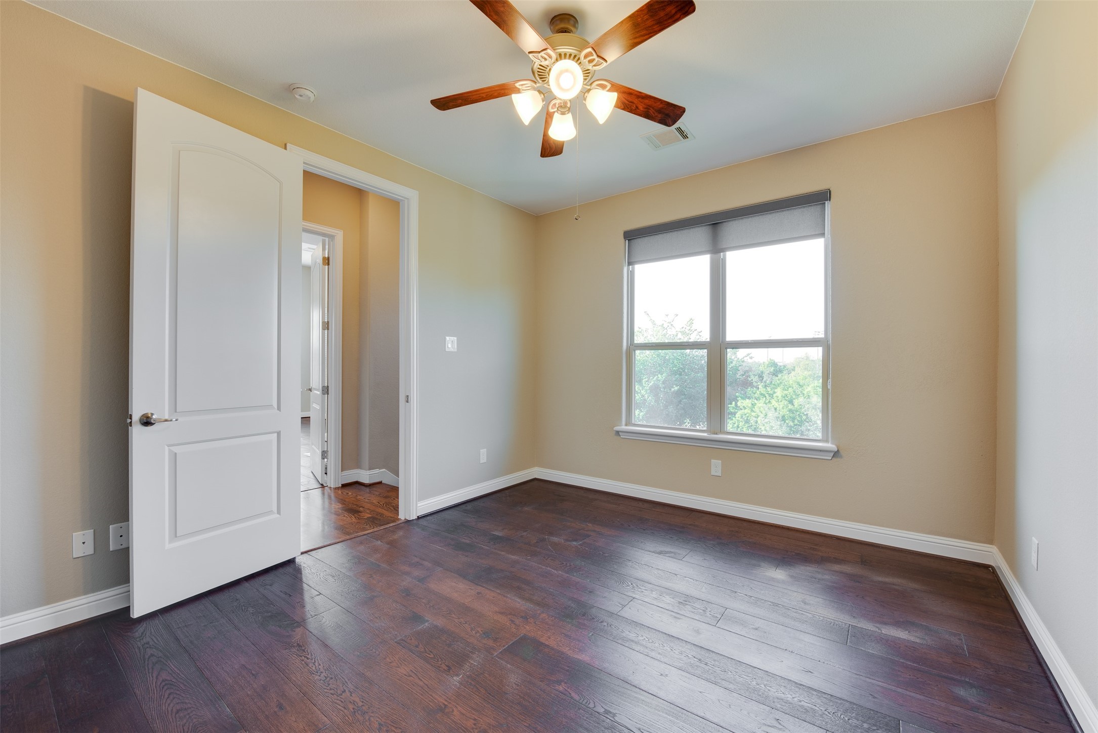 6105 Stillman Street Houston, TX 77007 - Photo 27 of 33 a view of an empty room with window and wooden floor