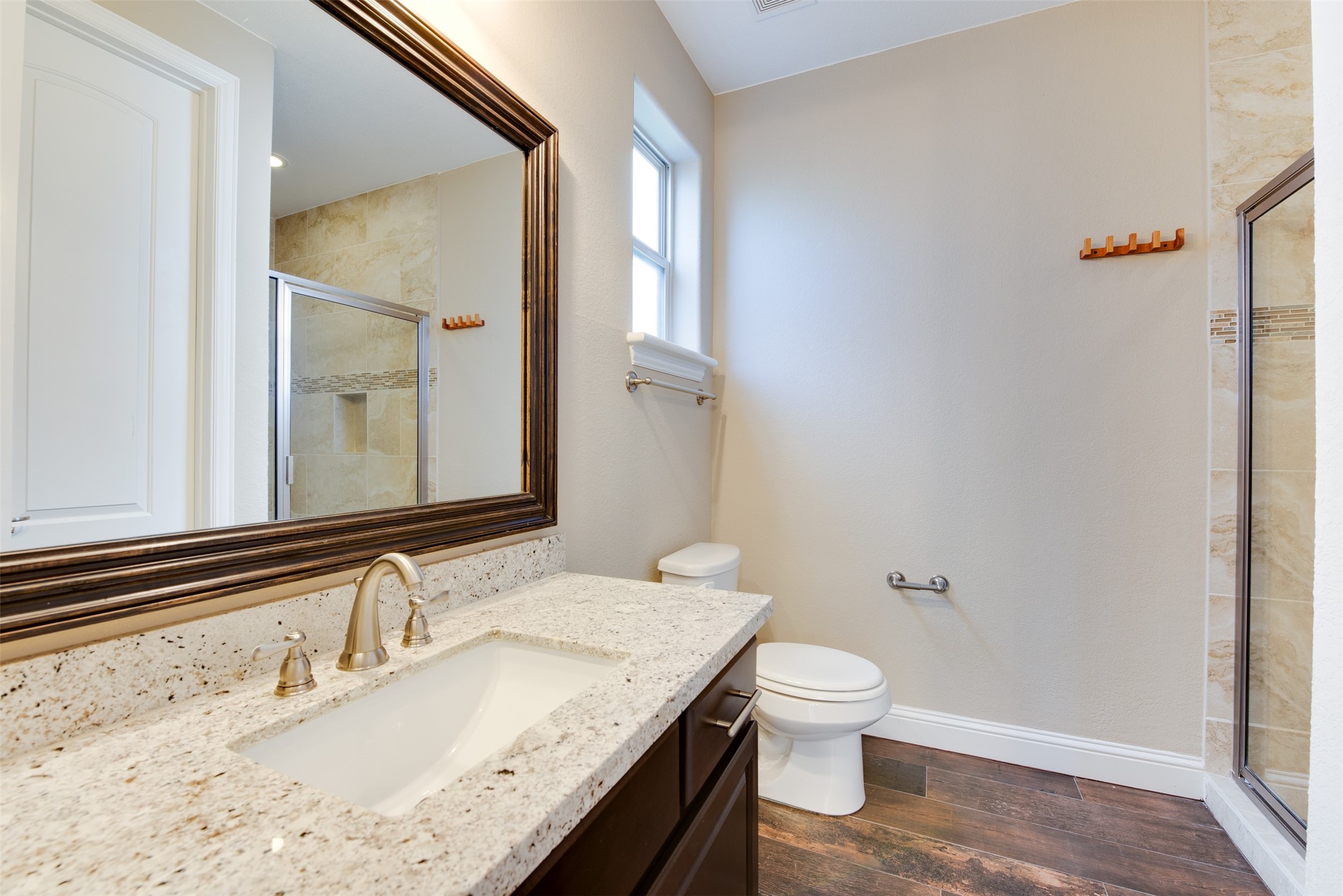 6105 Stillman Street Houston, TX 77007 - Photo 5 of 33 a bathroom with a granite countertop sink toilet and shower