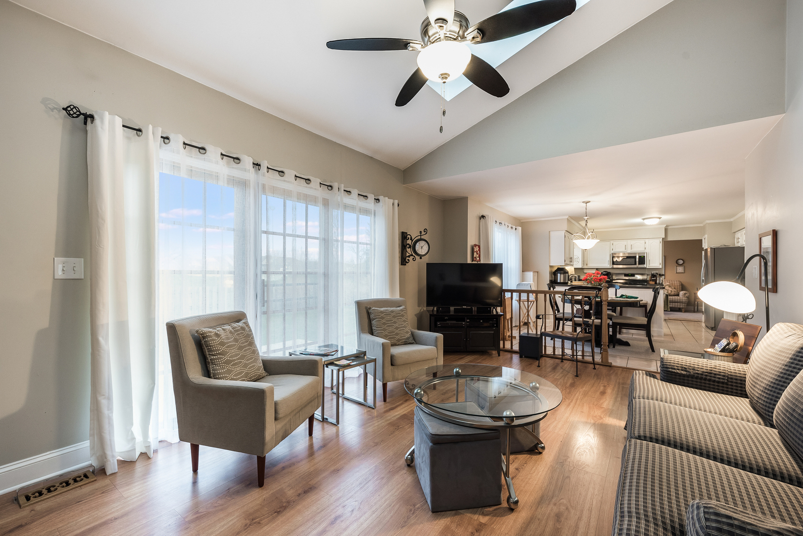 716 Pinehurst Lane Oswego, IL 60543 - Photo 13 of 25 a living room with furniture and a large window
