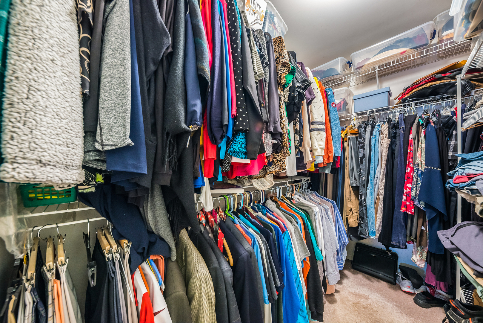 716 Pinehurst Lane Oswego, IL 60543 - Photo 21 of 25 a view of walk in closet with clothes and shoes