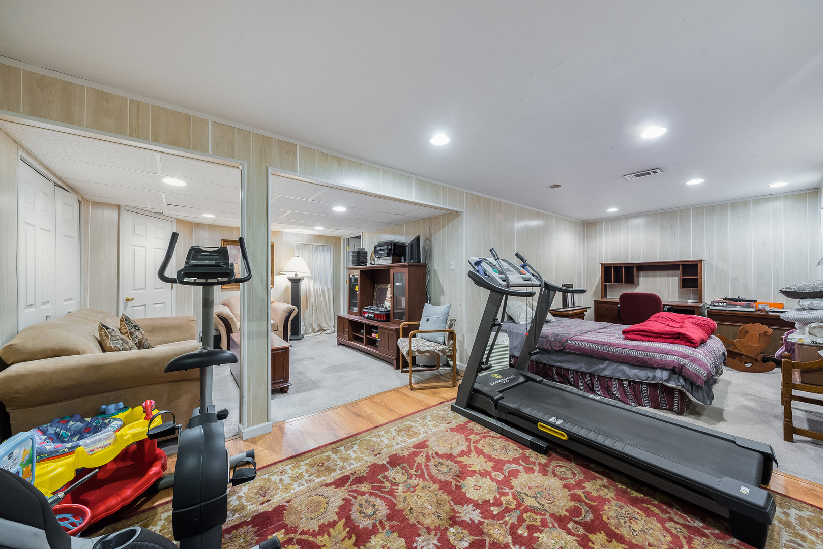 716 Pinehurst Lane Oswego, IL 60543 - Photo 23 of 25 a living room with furniture and a rug