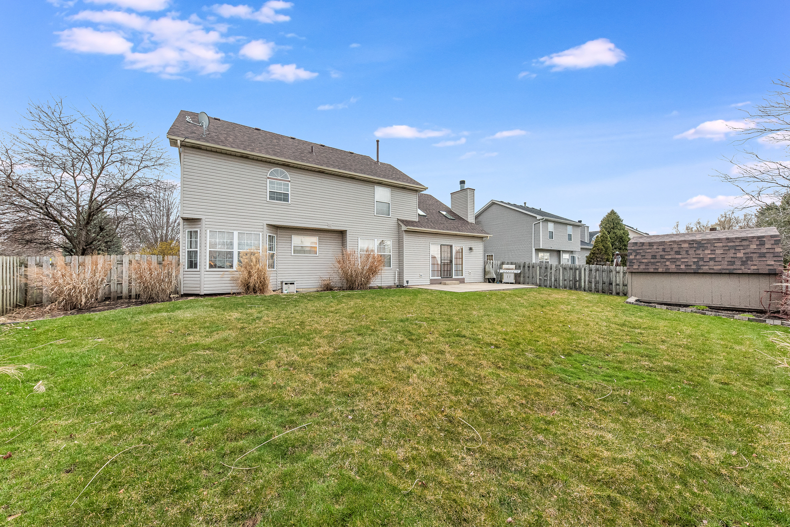716 Pinehurst Lane Oswego, IL 60543 - Photo 25 of 25 a house view with a garden space
