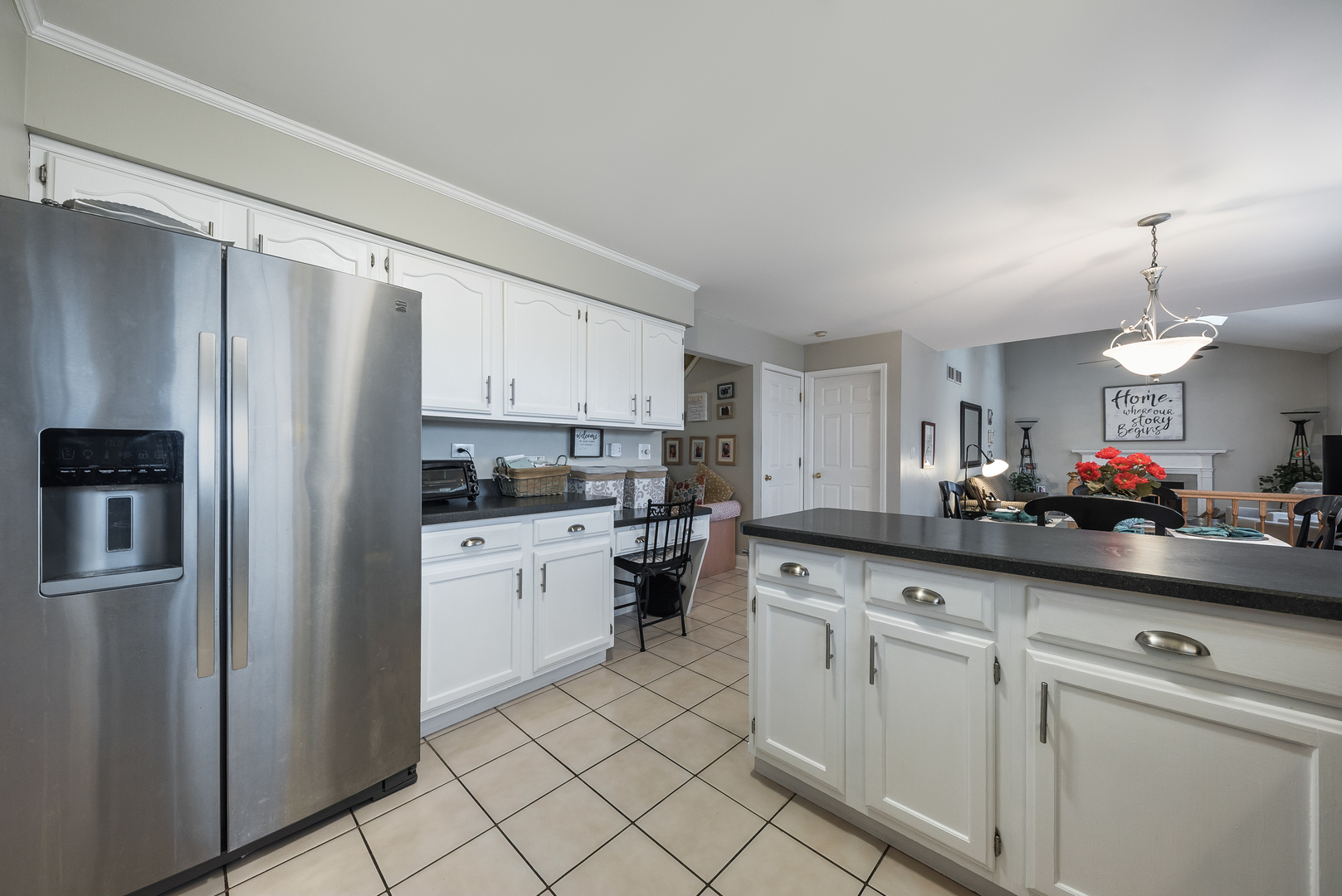 716 Pinehurst Lane Oswego, IL 60543 - Photo 9 of 25 a kitchen with white cabinets and refrigerator