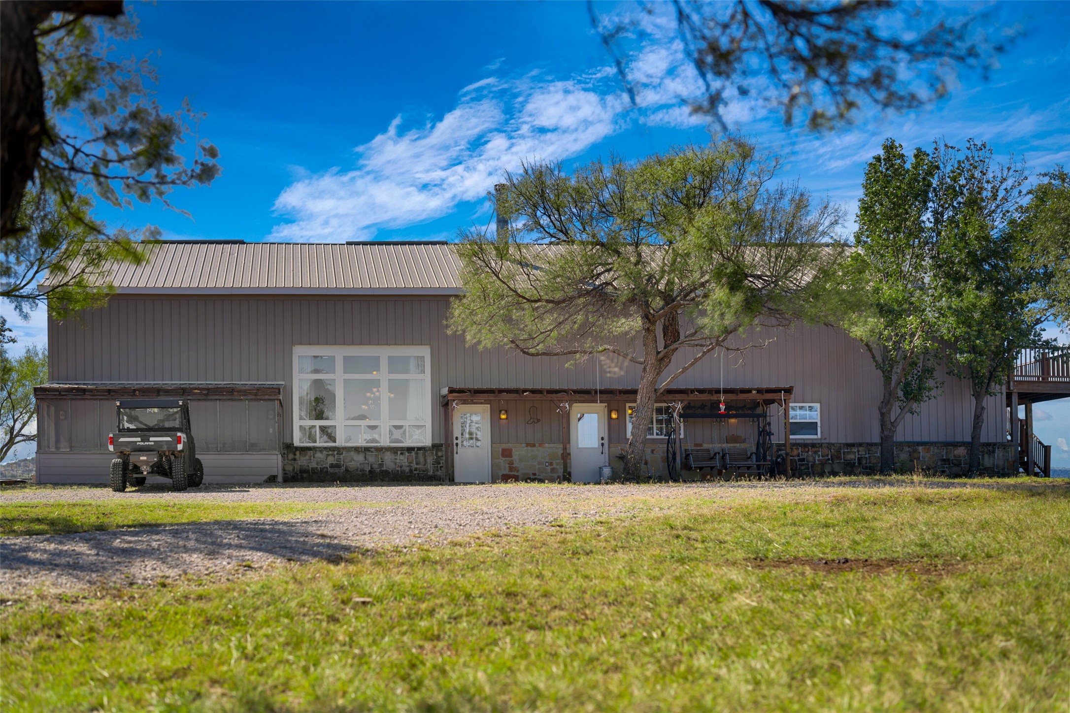 7702 Ranch Road 965 Llano, TX 78643 - Photo 4 of 40 a front view of a house with a yard