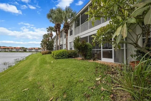 a view of a garden with a building in the background
