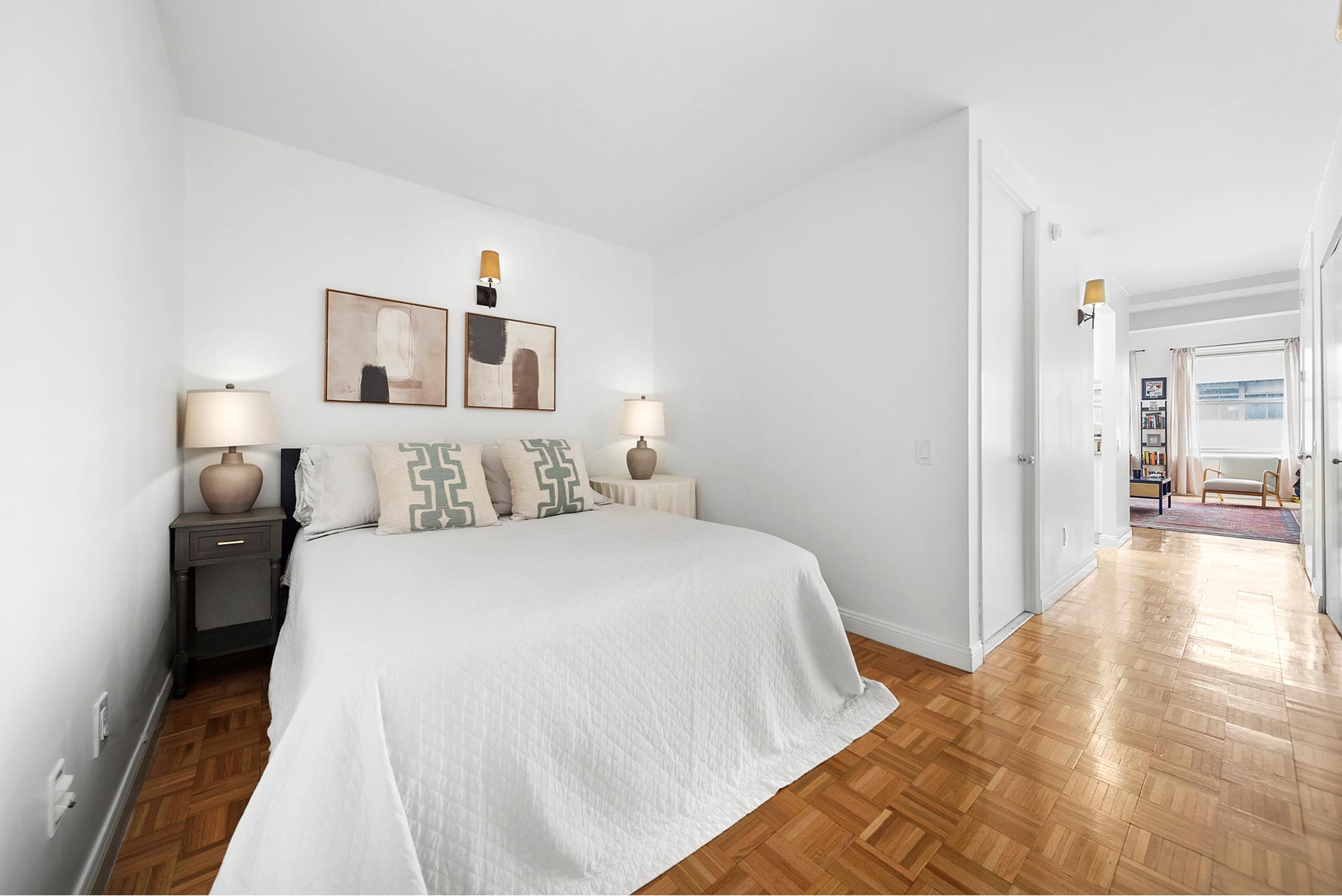 88 Greenwich Street, Unit 424 Manhattan, NY 10006 - Photo 4 of 5 a bedroom with a bed and wooden floor