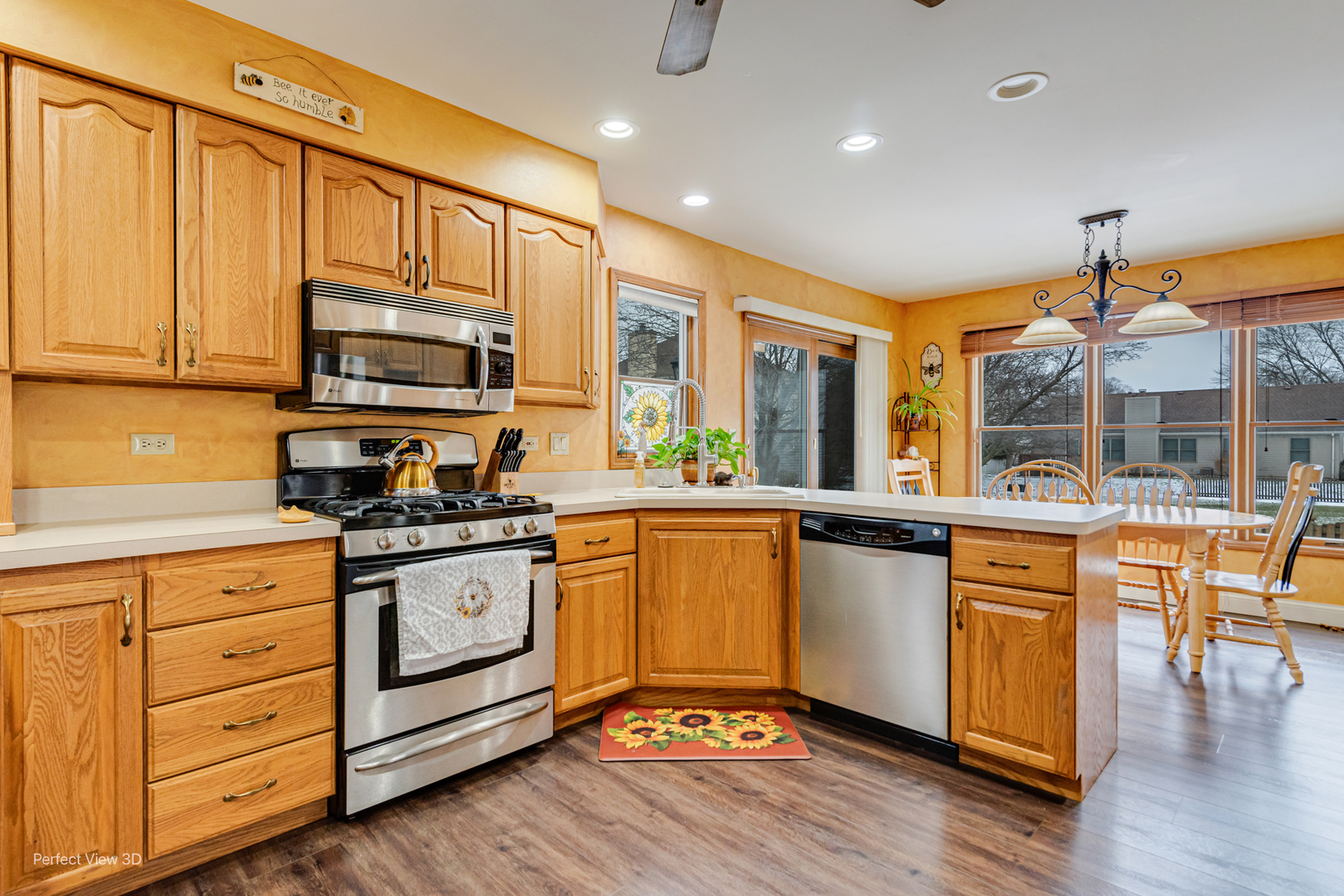 1910 Hampton Court Plainfield, IL 60586 - Photo 11 of 36 a kitchen with stainless steel appliances granite countertop a stove and cabinets
