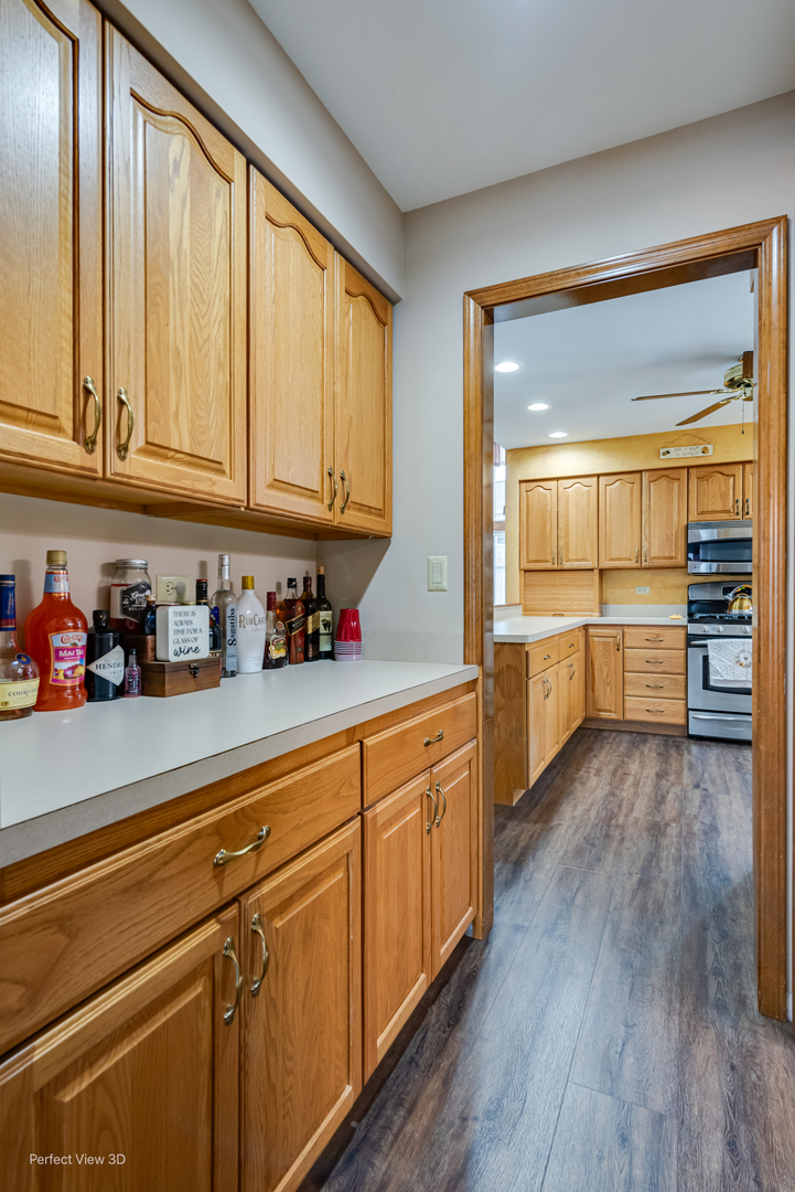 1910 Hampton Court Plainfield, IL 60586 - Photo 14 of 36 a kitchen with stainless steel appliances granite countertop a stove and cabinets