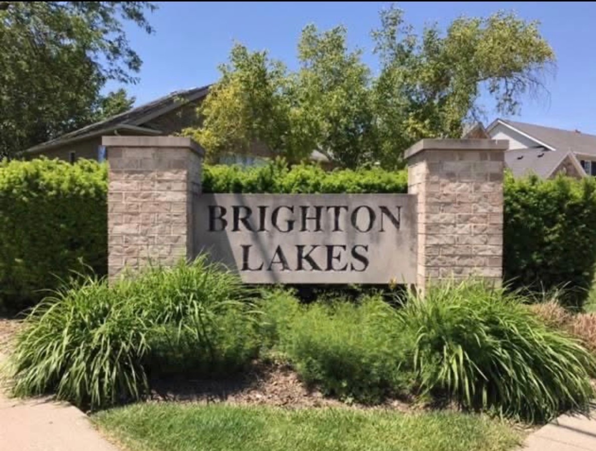 1910 Hampton Court Plainfield, IL 60586 - Photo 2 of 36 a sign on the side of a building