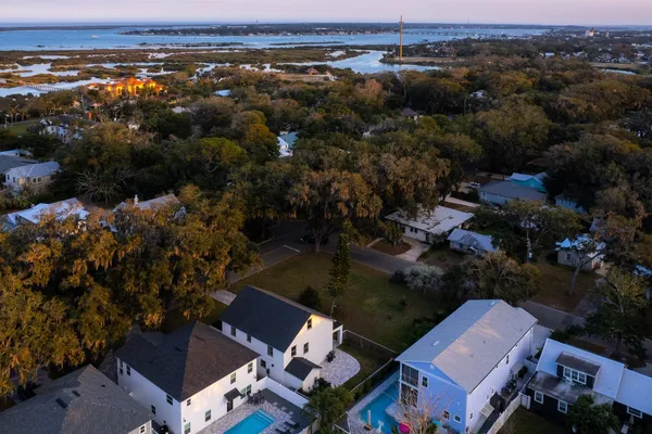 an aerial view of residential houses with outdoor space