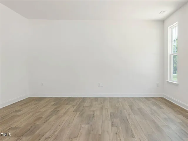 a kitchen with granite countertop white cabinets and a sink