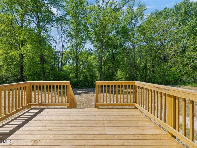 a spacious bathroom with a double vanity sink and mirror