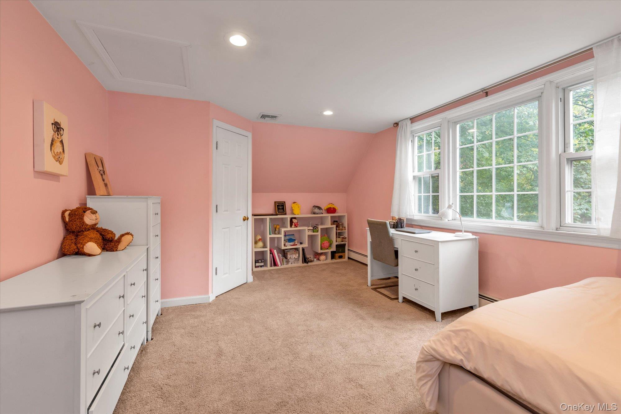 2177 Cedar Swamp Road Glen Head, NY 11545 - Photo 15 of 18 a view of a bedroom with workspace and windows