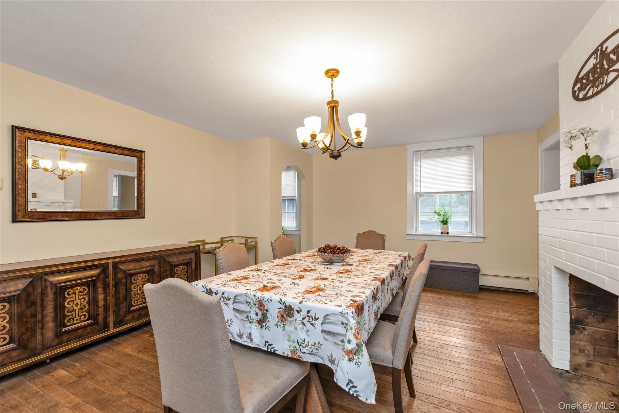 2177 Cedar Swamp Road Glen Head, NY 11545 - Photo 4 of 18 a view of a dining room with furniture window and wooden floor