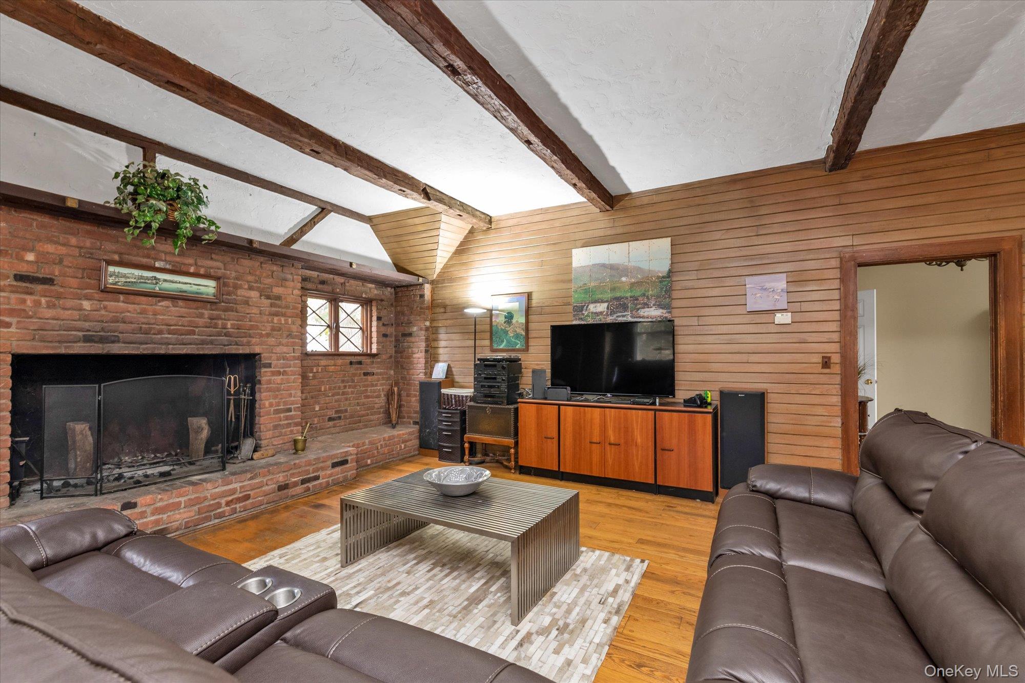 2177 Cedar Swamp Road Glen Head, NY 11545 - Photo 8 of 18 a living room with furniture and a flat screen tv