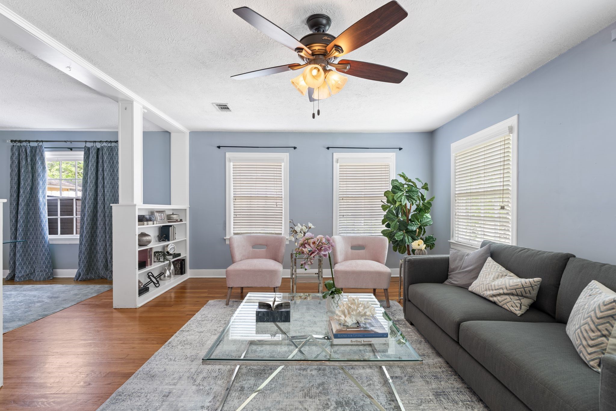 1102 Winston Street Houston, TX 77009 - Photo 14 of 30 a living room with furniture a rug and a chandelier